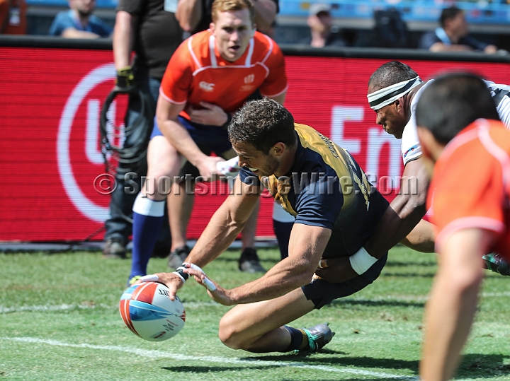 2018RugbySevensSat-24.JPG - Franco Sabato of Argentina scores a try against Fiji in the men's championship quarter finals of the 2018 Rugby World Cup Sevens, Saturday, July 21, 2018, at AT&T Park, San Francisco. Fiji defeated Argentina 43-7. (Spencer Allen/IOS via AP)